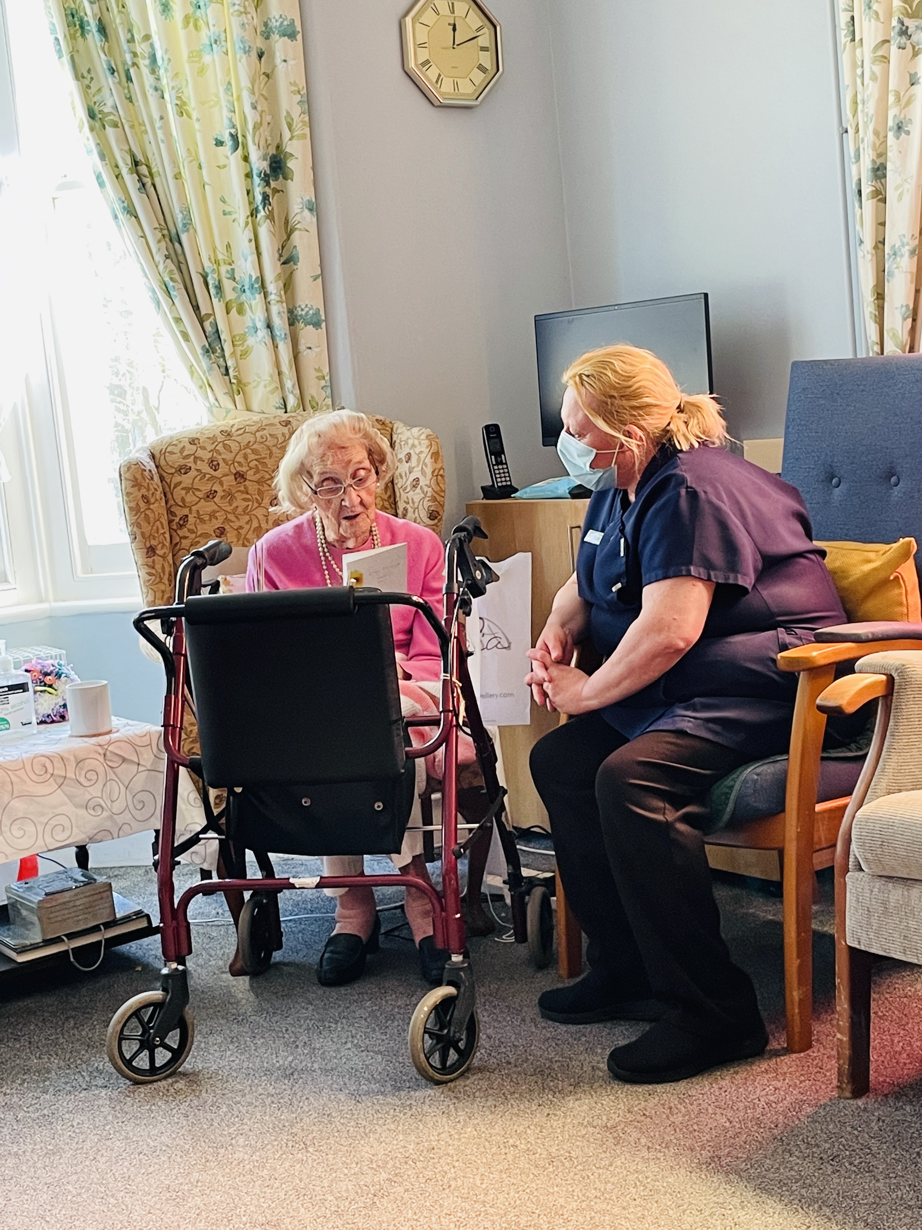 A carer with one of our residents